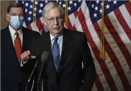  ?? NICHOLAS KAMM — THE ASSSOCIATE­D PRESS POOL ?? Senate Majority Leader Mitch McConnell, R-Ky., has declined to say publicly how he will handle an incoming House bill calling for $2,000 pandemic relief checks.