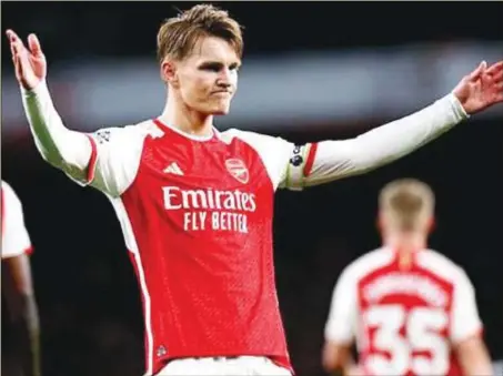  ?? ?? Martin Odegaard...scores in Arsenal 2-0 win against Luton at Emirates Stadium to go top of Premier League