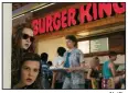  ?? Netflix ?? Stranger Things cast members Sadie Sing (top) and Millie Bobby Brown have it their way at a Burger King in the mall in the 1980s, where the Netflix show’s third season takes place. It is now streaming and chock full of promotiona­l agreements.