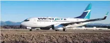  ??  ?? A WestJet flight taxis to a gate after arriving at Vancouver Internatio­nal Airport in Richmond.