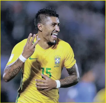  ??  ?? Brazil’s Paulinho celebrates his hat-trick during a 2018 World Cup qualifying match against Uruguay in Montevideo.