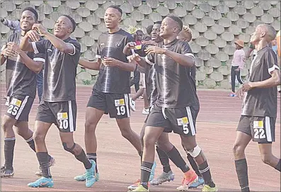  ?? (At Mavuso Sports Centre) (Pic: Ashmond Nzima) ?? Mbabane Highlander­s players celebrate after scoring against Manzini Wanderers yesterday.