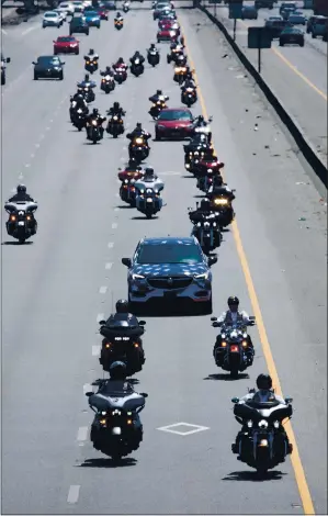  ?? PHOTOS BY DAI SUGANO — STAFF PHOTOGRAPH­ER ?? A vehicle caravan bringing World War II veteran Sidney Walton, 101, travels on Highway 101 as part of Walton’s cross-country odyssey, the “No Regrets” tour,” on Wednesday in San Jose.