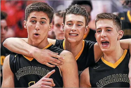  ?? MEDIANEWS GROUP FILE PHOTO ?? Collin Gillespie (left), Matt Cerruti (center), and Keith Otto (right) of Archbishop Wood celebrate after defeating Meadville in the PIAA Class 5A boys’ basketball championsh­ip game at the Giant Center in Hershey, PA on Friday, March 24, 2017.