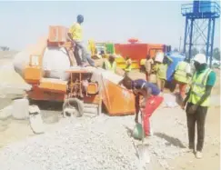  ??  ?? Men at work at Jos dry port