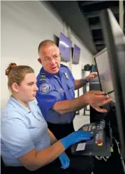  ??  ?? Left: Transporta­tion Security Administra­tion officer candidate Shasta Terry gets help from instructor Frank Crane as she learns to scan bags during an airport security training session.