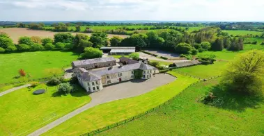  ??  ?? The historic Meath home is set on 18 acres with a number of outbuildin­gs, including an apartment block, right, that could provide rental income or be used for staff accommodat­ion