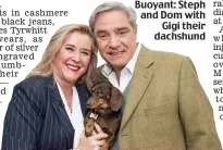  ??  ?? Buoyant: Steph and Dom with Gigi their dachshund
