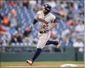  ?? NICK WASS — THE ASSOCIATED PRESS ?? The Houston Astros’ Jose Altuve rounds third on his home run during the first inning against the Washington Nationals on Friday in Washington.