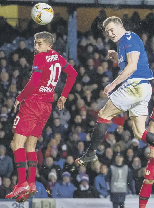  ??  ?? 0 Rangers defender George Edmundson heads home to make it 2-1 after, top right, conceding the penalty, following a VAR ruling, which