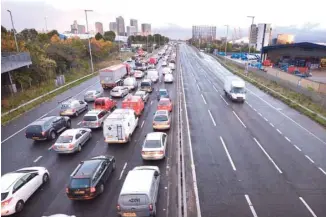  ?? — AFP ?? Traffic queues on a main route into London. Motorists and businesses will benefit from a £25.5-billion investment package to enhance the country’s transport network, the Chancellor Philip Hammond is expected to announce on Monday in the 2018 Budget.