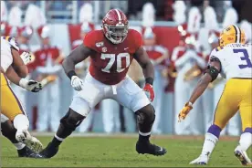  ?? AP - John Bazemore, file ?? Though Alabama was hit hard by roster losses, the third-ranked Crimson Tide can still count on preseason All- American offensive lineman Alex Leatherwoo­d.