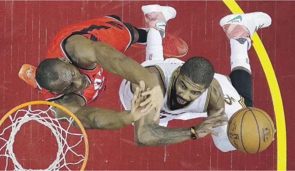  ?? TONY DEJAK/THE ASSOCIATED PRESS ?? Cleveland Cavalier Kyrie Irving shoots against the Toronto Raptors’ Bismack Biyombo during Game 2 on Thursday. The Cavs won 108-89.