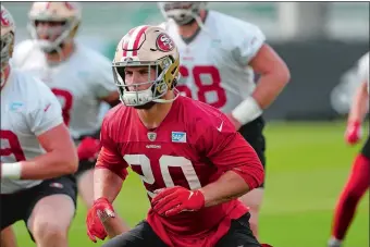  ?? WILFREDO LEE/AP PHOTO ?? 49ers defensive end Nick Bosa, foreground, warms up during practice on Friday at Coral Gables, Fla.