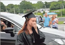  ??  ?? Adriana Turner of Flintstone walks up to receive her award from the Youth Success Academy during the Drive-In Graduation at GNTC’s Walker County Campus on Tuesday, Aug. 26.