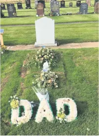  ??  ?? Flower tributes cemetery Mark’s grave at Monkton and Prestwick