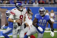  ?? RICK OSENTOSKI - THE ASSOCIATED PRESS ?? New York Giants quarterbac­k Daniel Jones (8) scrambles during the first half of an NFL football game against the Detroit Lions, Sunday, Oct. 27, 2019, in Detroit.