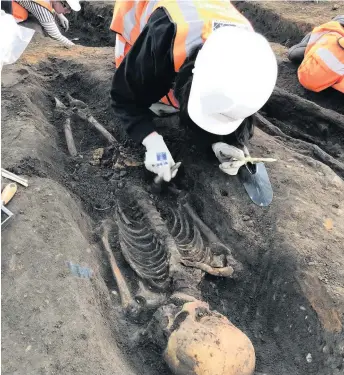  ??  ?? &gt; Excavation of a skeleton at Park Street burial ground in Birmingham