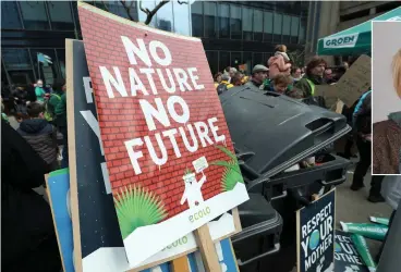  ?? (Reuters) ?? PLACARDS ARE pictured during the ‘Rise for Climate’ demonstrat­ion in Brussels on March 31.