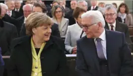  ?? Kay Nietfeld/Associated Press ?? German Chancellor Angela Merkel and German President Frank-Walter Steinmeier.