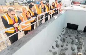  ?? Photo / File ?? Napier City councillor­s at the new Awatoto plant in 2014, overlookin­g a channel leading to the outfall, which itself must now be repaired or replaced.