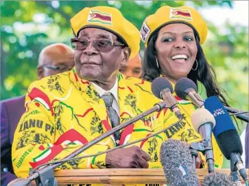  ?? Jekesai Njikizana AFP/Getty Images ?? ZIMBABWEAN President Robert Mugabe paved the way for his wife, Grace, to become vice president with the removal of Emmerson Mnangagwa. Until recently, Mnangagwa was seen as Mugabe’s likely successor.