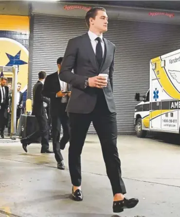  ?? Andy Cross, The Denver Post ?? Avalanche defenseman Nikita Zadorov, considered among the Avalanche’s best dressers, enters Bridgeston­e Arena for the first game of round one of the Stanley Cup playoffs on Thursday.