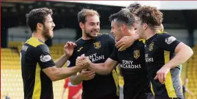  ??  ?? Opener The Livi players celebrate going in front against Alloa