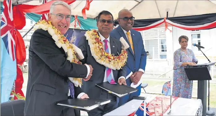  ?? Picture: FILE ?? Australian High Commission­er to Fiji Ewen McDonald, left, Deputy Prime Minister and Minister for Finance, Prof Biman Prasad, and Minister for Health Dr Atonio Lalabalavu at the signing event for the $14.7m funding agreement to support a comprehens­ive master plan for the Colonial War Memorial Hospital.