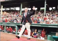  ?? Winslow Townson / Associated Press ?? Former Red Sox pitcher Curt Schilling waves to the crowd after being introduced as a new member of the Red Sox Hall of Fame in 2012.