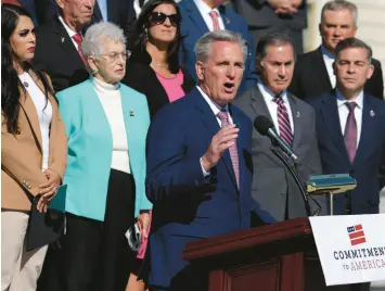  ?? ALEX WONG/GETTY ?? House Minority Leader Kevin McCarthy, center, said last month that “blank check” aid for Ukraine could change if fellow Republican­s take control of the chamber.