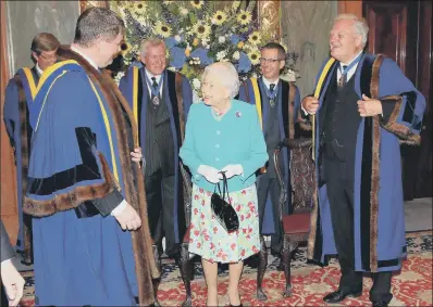  ??  ?? The Queen visits Drapers’ Hall for a luncheon to mark the 70th anniversar­y of her Admission to the Freedom of the Company.