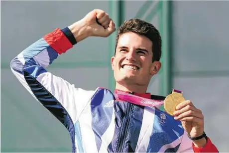  ??  ?? Reuters file Britain’s Peter Wilson with his gold medal at the victory ceremony for the men’s double trap shooting event at the London 2012 Olympic Games last year. Wilson says he’s now looking forward to competing in another Olympics.