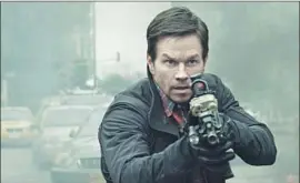  ?? STXfilms ?? OPERATIVE Jimmy Silva (Mark Wahlberg) is armed with a gun and sarcasm.