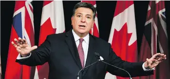  ?? CHRISTOPHE­R KATSAROV/THE CANADIAN PRESS ?? “An increase to minimum wage cannot wait,” Ontario Finance Minister Charles Sousa told reporters in Toronto on Tuesday.