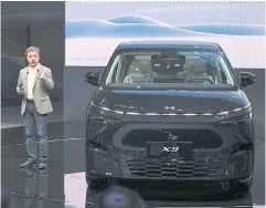  ?? AFP ?? He Xiaopeng, CEO of Chinese electric vehicle maker Xpeng, speaks during a launch event at Auto China in Beijing yesterday.