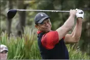  ?? KEVIN KOLCZYNSKI — THE ASSOCIATED PRESS FILE ?? Tiger Woods tees off of the 3rd hole during the final round of the PNC Championsh­ip golf tournament on Dec. 18, 2022, in Orlando, Fla.