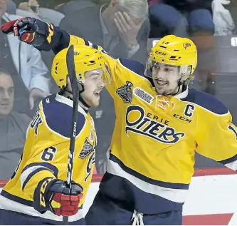  ?? ADRIAN WYLD/THE CANADIAN PRESS ?? Erie Otters’ Dylan Strome celebrates his goal against the Saint John Sea Dogs with teammate Jordan Sambrook during third period Memorial Cup semifinal hockey action in Windsor on Friday.