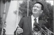  ?? AP/MARCO GARCIA ?? Hawaii’s attorney general, Douglas Chin, speaks Wednesday outside the federal courthouse in Honolulu after a federal judge blocked President Donald Trump’s latest travel ban order.