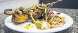  ?? ANDREW LAHODYNSKY­J FOR THE TORONTO STAR ?? Bater, a tandoori quail, is one of the delicacies at King Tandoori in Brampton.