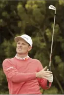  ?? AP photo ?? Justin Rose watches his tee shot on Pebble Beach’s 12th hole during the first round of the U.S. Open on Thursday.