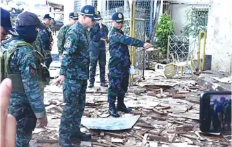  ??  ?? Police Director General Oscar Albayalde looks at the debris after the January 27 bombings of Jolo cathderal.