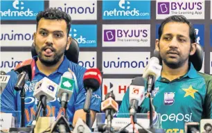  ??  ?? Rohit Sharma and Sarfraz Ahmed speak to the media ahead of the Asia Cup. —