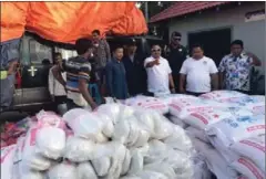  ?? SUPPLIED ?? Kandal provincial authoritie­s inspect 4 tonnes of rice that was suspected of being imported illegally from Vietnam yesterday.