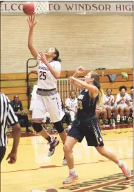  ?? Emily J. Reynolds / For Hearst Connecticu­t Media ?? Windsor’s Denise Solis goes up for a shot over Newington’s Maya Gajowiak in a January 2019 game. Solis is playing college ball at UMass-Lowell, which will take on UConn on Dec. 12.