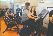  ??  ?? MEMBERS of media testing the Matrix retail line of cardio fitness equipment during last week’s launch.