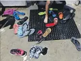  ?? Gary Coronado Los Angeles Times ?? FLIP-FLOPS shed by parkgoers pile up at the spray pool at Lemon Park in Fullerton.