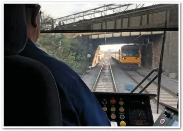  ??  ?? Tram meets train; the view from the driver’s cab of an approachin­g stopping service just north of Rotherham Central. This was the last of the ‘ghost runs’ before the service began.