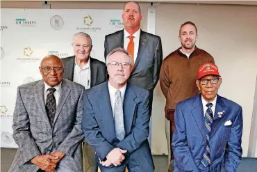  ?? OKLAHOMAN]
[PHOTO BY STEVE GOOCH, THE ?? The 2017 Oklahoma Sports Hall of Fame Inductees (front row, from left) Jeff Bennett, David James and Reverend Bill Greason. (Back row, from left) Bill Krisher, Bryant “Big Country” Reeves and Jason White. The inductees spoke at a Leadership Luncheon on...