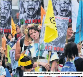  ??  ?? > Extinction Rebellion protesters in Cardiff last month